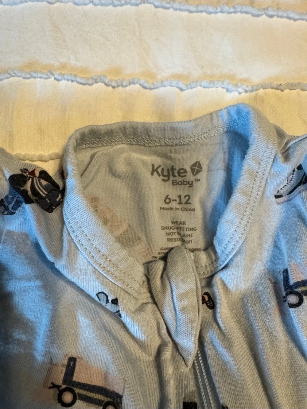 Kyte BABY 6-12 mo Light Blue Hockey & Skate Print Footed One-Piece